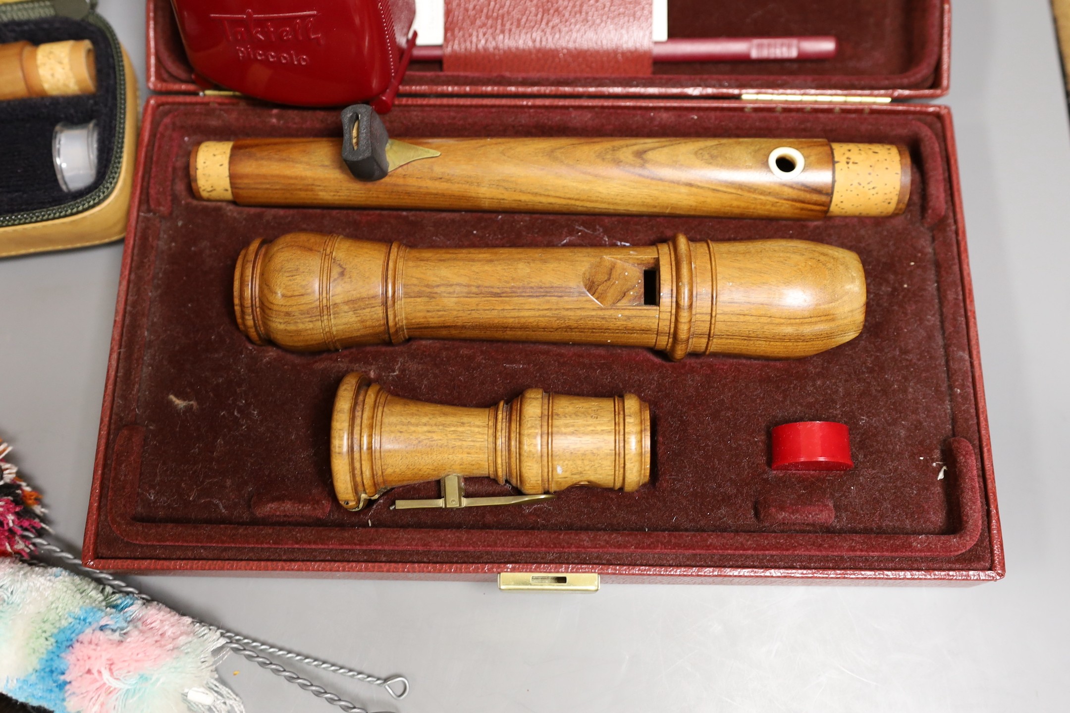 Two cased recorders, one other and a metronome etc